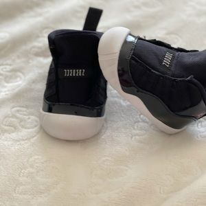 Black Jordan 11 crib bootie